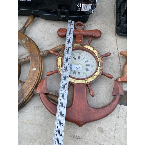 1493 - A WOODEN SHIPS WHEEL AND A NAUTICAL CLOCK