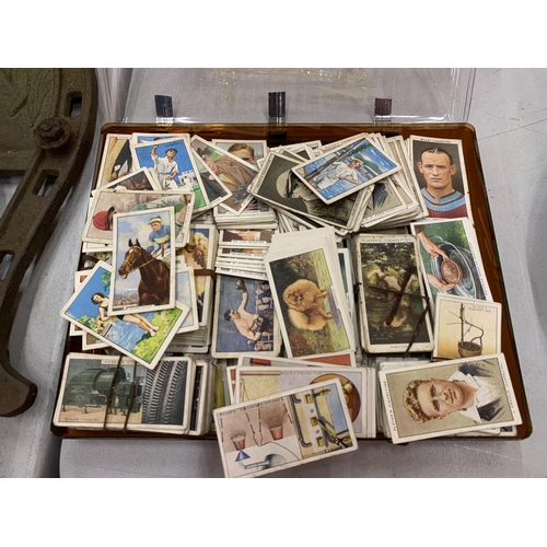 158 - A LARGE COLLECTION OF CIGARETTE CARDS TO INCLUDE HOUSEHOLD HINTS, DOGS, SPORTING, ETC