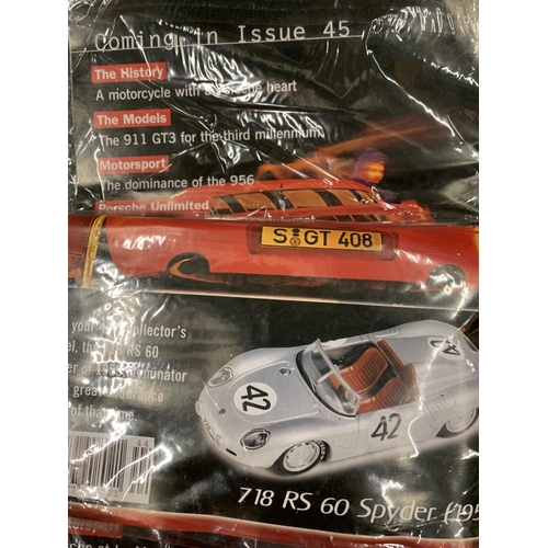 181 - TWO DEAGOSTINI PORSCHE MODEL COLLECTIONS MAGAZINES WITH PORSCHE CARS