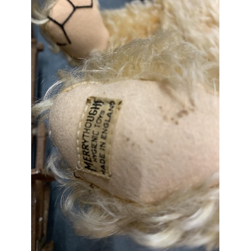 192 - A VINTAGE MERRYTHOUGHT TEDDY BEAR WITH A BUTTON IN HIS EAR AND LABEL TO FOOT