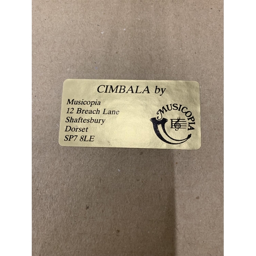 194 - A CIMBALA MUSICAL INSTRUMENT WITH MUSIC - BOXED