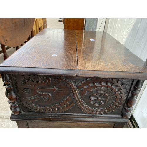 2209 - AN 18TH CENTURY OAK BIBLE BOX ON LATER STAND WITH CARVING AND INSCRIPTION TO THE FRONT PANEL (1715, ... 