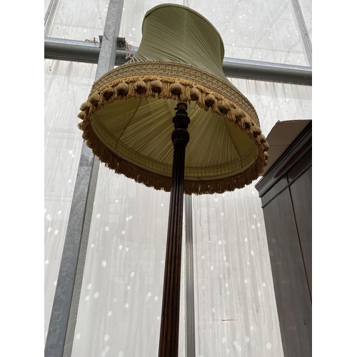 2211 - A MID 20TH CENTURY STANDARD LAMP ON TURNED AND FLUTED COLUMN COMPLETE SHADE