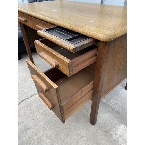 2217 - A MID 20TH CENTURY 'ABBESS' OAK SINGLE PEDESTAL OFFICE DESK, 48X26