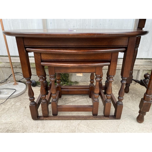 2232 - A NEST OF THREE OAK 'OLD CHARM' TABLES