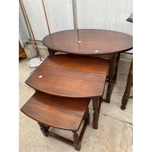 2232 - A NEST OF THREE OAK 'OLD CHARM' TABLES