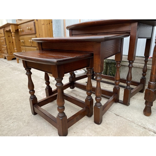 2232 - A NEST OF THREE OAK 'OLD CHARM' TABLES