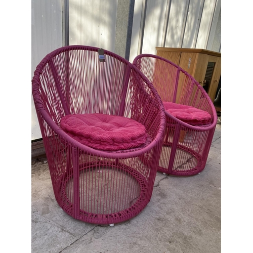 2243 - A PAIR OF PINK 'APOPULCO' STYLE PVC CORD CHAIRS WITH PINK CUSHIONS