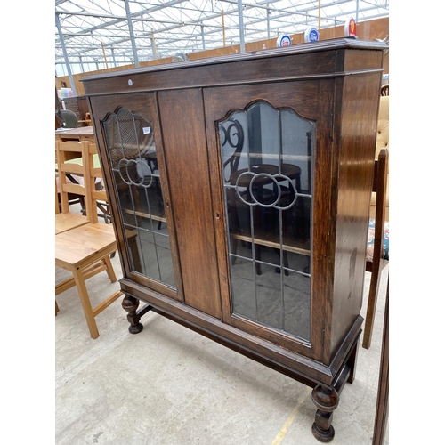 2267 - AN EARLY 20TH CENTURY OAK GLAZED AND LEADED BOOKCASE ON OPEN BASE WITH BULBOUS FRONT LEGS, 41