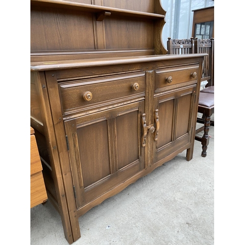 2303 - AN ERCOL DRESSER WITH CUPBOARDS AND DRAWERS TO THE BASE, COMPLETE WITH PLATE RACK, 48