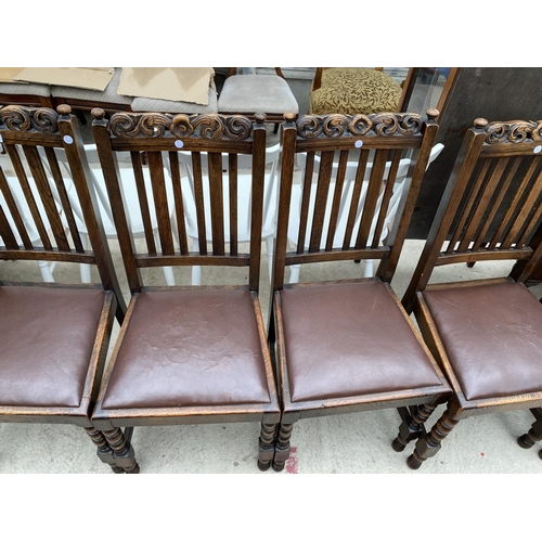 2304 - A SET OF SIX EARLY 20TH CENTURY OAK JACOBEAN STYLE DINING CHAIRS WITH CARVED TOP RAIL AND TURNED LEG... 