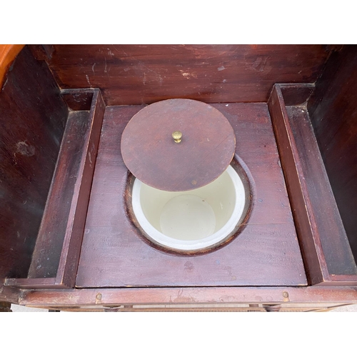 2305 - A 19TH CENTURY MAHOGANY CHEST COMMODE WITH TURNED HANDLES AND BALL FLUTED LEGS