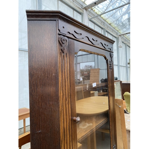 2317 - A MODERN OAK GLAZED CORNER CUPBOARD WITH CUPBOARD TO THE BASE