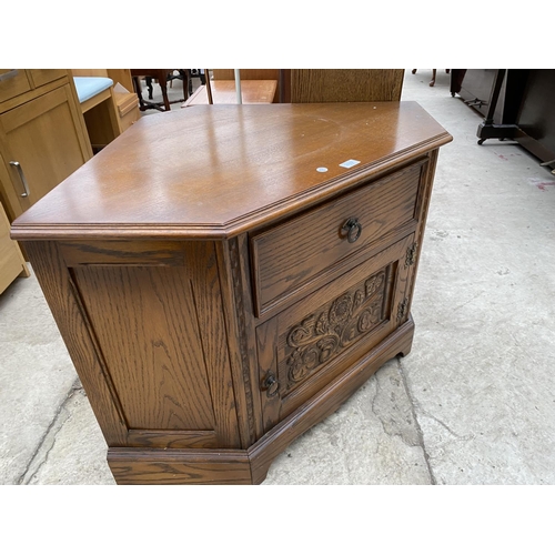 2327 - AN OAK 'JAYCEE' CORNER TV STAND