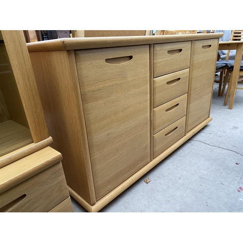 2336 - A MODERN OAK SIDEBOARD ENCLOSING FOUR DRAWERS AND TWO CUPBOARDS, 59