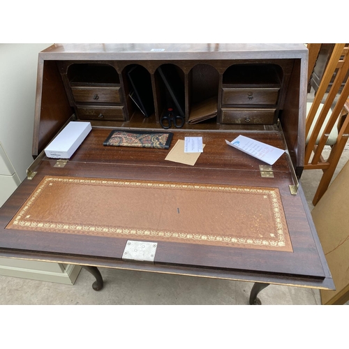 2342 - A REPRODUCTION MAHOGANY BUREAU ON CABRIOLE LEGS, 30