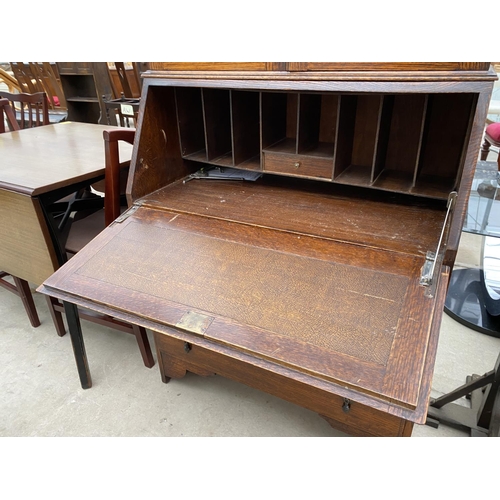 2345 - AN EARLY 20TH CENTURY OAK GLAZED AND LEADED BUREAU BOOKCASE, 32.5