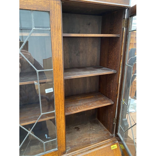 2345 - AN EARLY 20TH CENTURY OAK GLAZED AND LEADED BUREAU BOOKCASE, 32.5