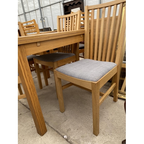 2392 - AN 'IKEA NORRNAS' DRAW-LEAF DINING TABLE AND FOUR CHAIRS