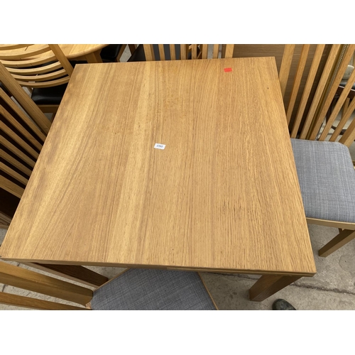 2392 - AN 'IKEA NORRNAS' DRAW-LEAF DINING TABLE AND FOUR CHAIRS