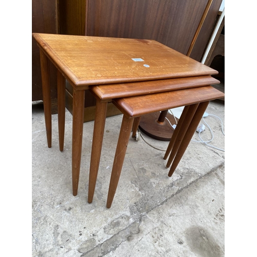 2402 - A RETRO TEAK NEST OF THREE TABLES