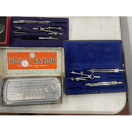 241 - A QUANTITY OF COMPASSES TO INCLUDE BIRK MADE IN GERMANY, RONSON LIGHTER, VINTAGE ROLLS RAZOR, ETC.,