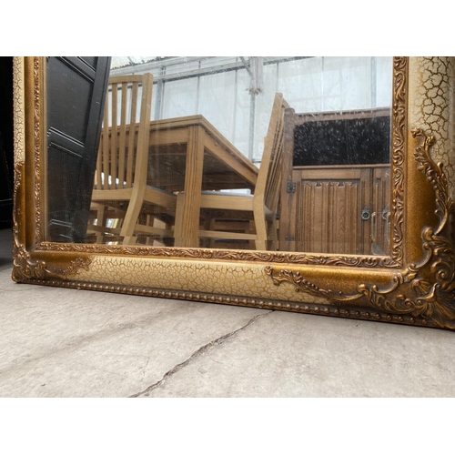 2416 - A GILT FRAMED WALL MIRROR WITH BEVEL EDGE, 42X30