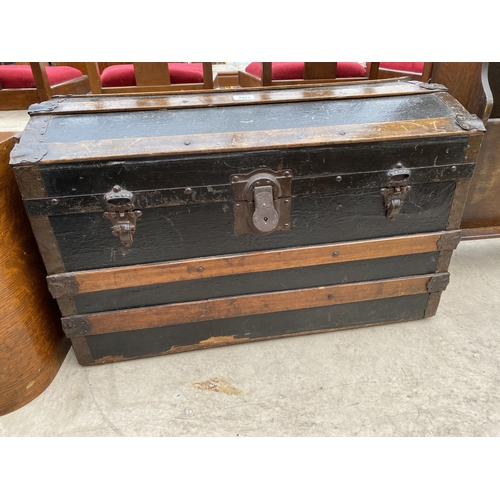 2423 - A 19TH CENTRY DOMED TOP BANDED TRAVELLING TRUNK