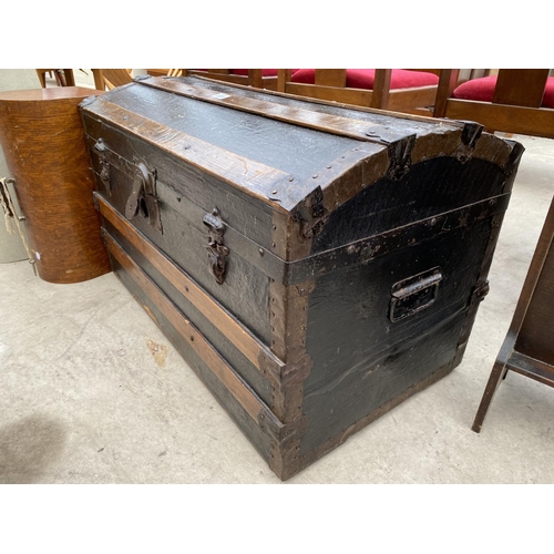 2423 - A 19TH CENTRY DOMED TOP BANDED TRAVELLING TRUNK