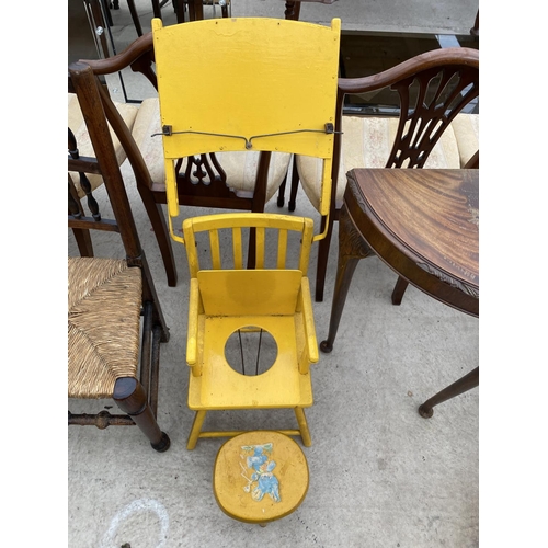 2435 - A BRIGHT YELLOW CHILDS CHAIR WITH FOLD-DOWN TRAY AND SMALL STOOL DECORATED WITH TEDDY BEAR