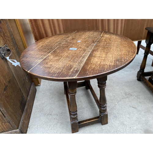 2440 - A MINIATURE OAK DROP-LEAF TABLE, 23