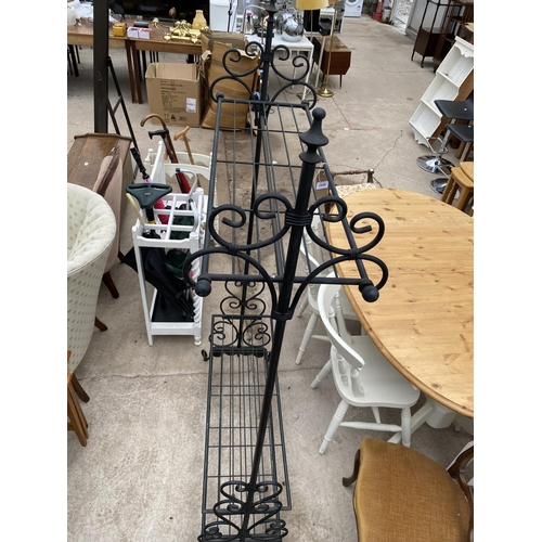 2448 - A MODERN TUBULAR METAL CLOTHES/SHOE RACK WITH FOLIATE DECORATION TO THE BASE, 38