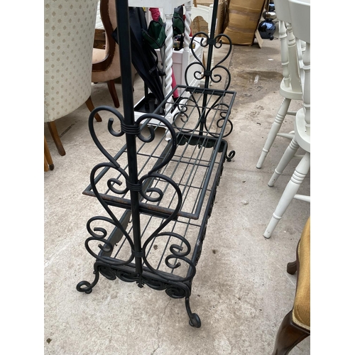 2448 - A MODERN TUBULAR METAL CLOTHES/SHOE RACK WITH FOLIATE DECORATION TO THE BASE, 38