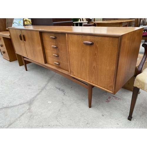 2463 - A RETRO TEAK G-PLAN SIDEBOARD ENCLOSING FOUR DRAWERS AND THREE CUPBOARDS, 81