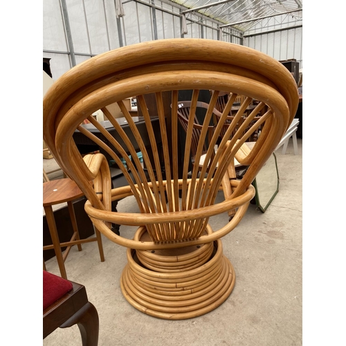 2469 - A MODERN BAMBOO/RATTAN SWIVEL CHAIR WITH SWEPT ARMS, ON TIERED BASE, LACKING CUSHIONS