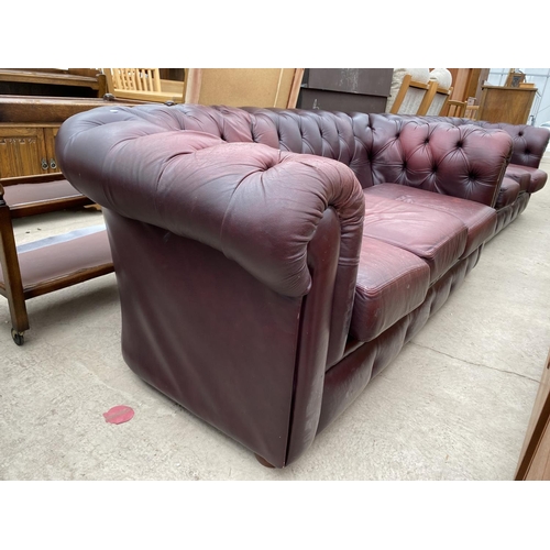 2473 - AN OXBLOOD CHESTERFIELD THREE SEATER SETTEE