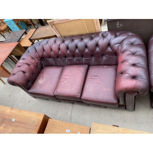 2473 - AN OXBLOOD CHESTERFIELD THREE SEATER SETTEE