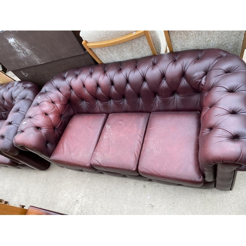 2474 - AN OXBLOOD CHESTERFIELD THREE SEATER SETTEE