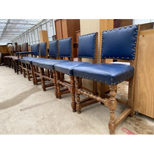 2479 - A SET SEVEN EARLY 20TH CENTURY JACOBEAN STYLE DINING CHAIRS WITH STUDDED BLUE UPHOLSTERY ON TURNED L... 