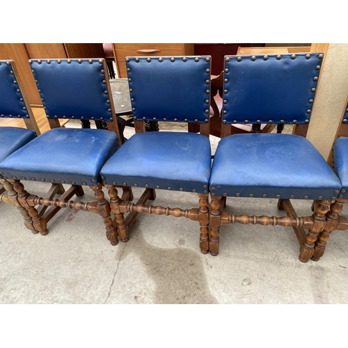 2479 - A SET SEVEN EARLY 20TH CENTURY JACOBEAN STYLE DINING CHAIRS WITH STUDDED BLUE UPHOLSTERY ON TURNED L... 