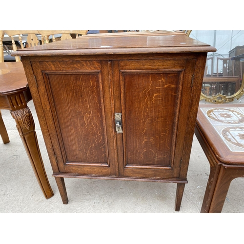 2498 - AN EARLY 20TH CENTURY PANELLED TWO DOOR CABINET ON OPEN BASE, 25.5