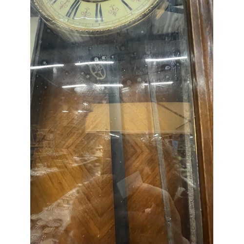 252 - A DOUBLE WEIGHTED WALL CLOCK