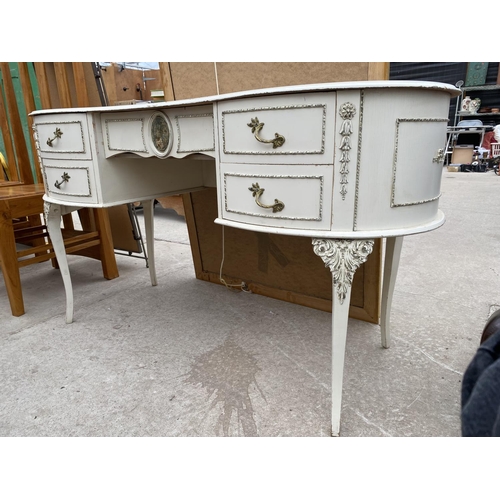 2520 - A WHITE AND GILT KIDNEY SHAPED DRESSING TABLE, 52