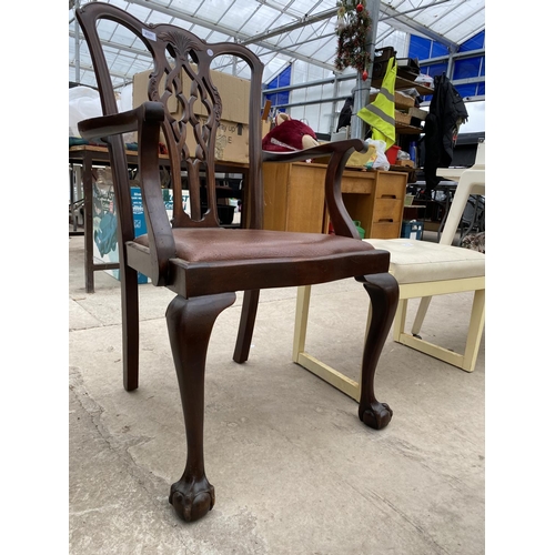 2521 - A 'CHIPPENDALE' STYLE ARMCHAIR ON CABRIOLE LEGS, WITH BALL AND CLAW FEET