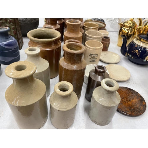 256 - A COLLECTION OF STONEWARE KITCHEN VESSELS TOGETHER WITH ADVERTISING STONEWARE