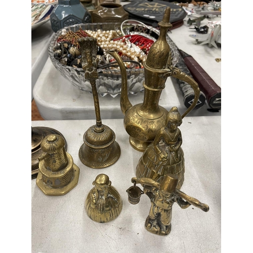 260 - A QUANTITY OF BRASSWARE TO INCLUDE A CANDLESTICK, FIGURES, BELL, AFTABA WATER PITCHER, ETC.,