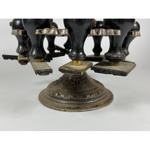 14 - AN UNUSUAL 19TH CENTURY BRASS TWO TIER REVOLVING STAMP HOLDER WITH ORIGINAL EBONY HANDLED STAMPS, HE... 