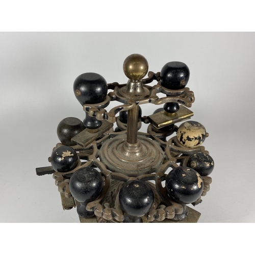 14 - AN UNUSUAL 19TH CENTURY BRASS TWO TIER REVOLVING STAMP HOLDER WITH ORIGINAL EBONY HANDLED STAMPS, HE... 