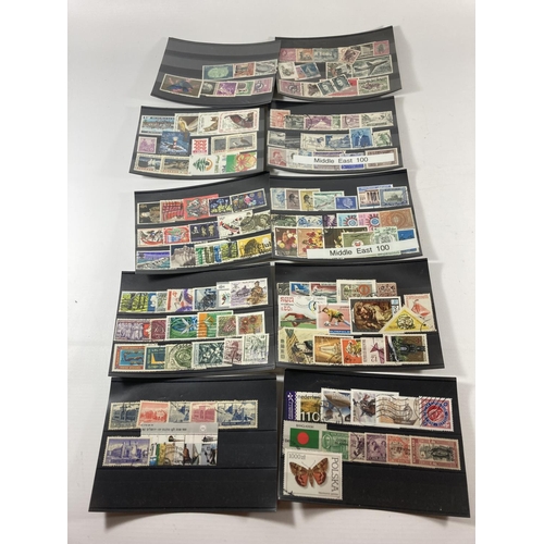 325 - A COLLECTION OF MAINLY MIDDLE EASTERN STAMPS ON LEAVES