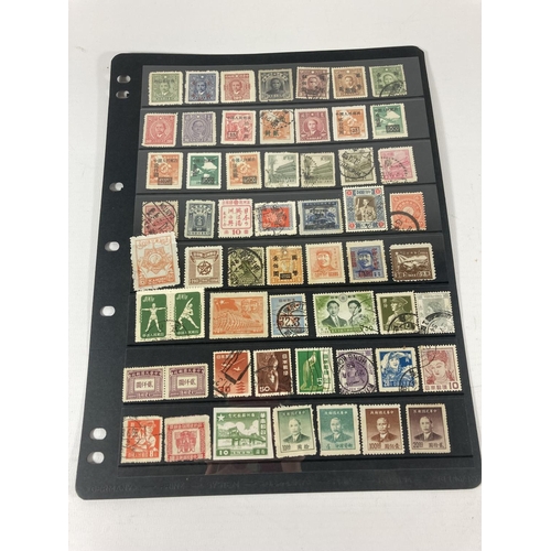 325 - A COLLECTION OF MAINLY MIDDLE EASTERN STAMPS ON LEAVES